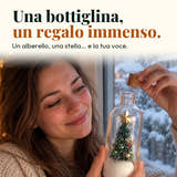 Foto illustrativa: una bottiglina, un regalo immenso. Un alberello, una stella… e la tua voce.
